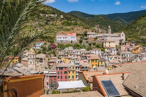 Colorful Architecture Of Vernazza Village In Aerial View And Churches