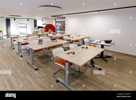 in a bright modern training room are chairs and benches Stock Photo - Alamy