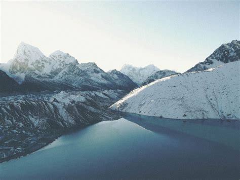 black and white snowy mountains beside body of water free image | Peakpx