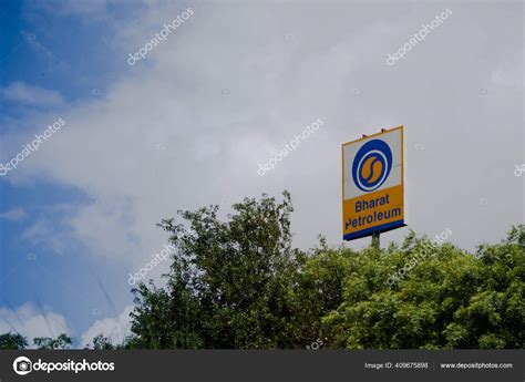 signage  bharat petroleum standing   middle  trees showing