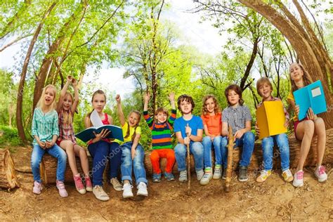 Kids reading books outdoor — Stock Photo © serrnovik #130011028