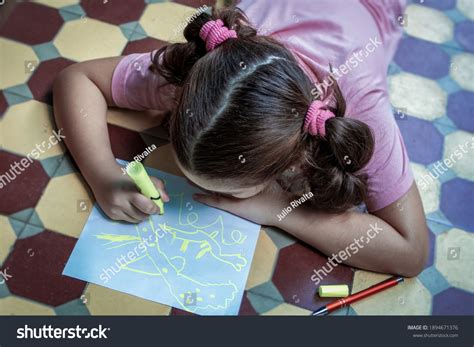 Little Girl Lying On Floor Drawing Stock Photo 1894671376 | Shutterstock