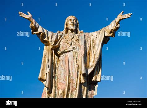 Weathered Statue Of Jesus Christ With Outstretched Arms Stock Photo Alamy