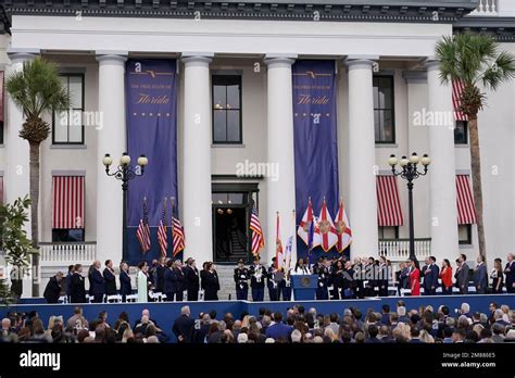 People Stand For The National Anthem During An Inauguration Ceremony At The Old Capitol Where