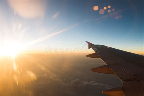 The Plane is Flying through the Sunset Sky Stock Image - Image of ...