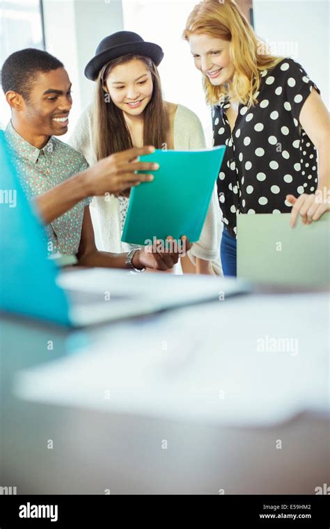 People working together in office Stock Photo - Alamy