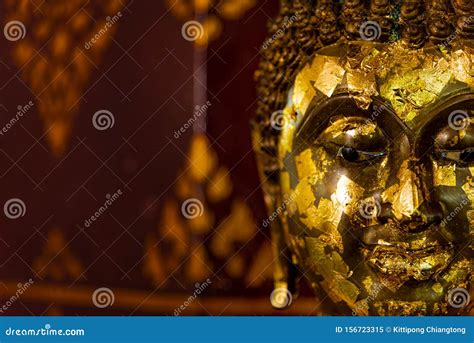 Close Up Of Side Face Of Grunge Golden Buddha Statue Symbol Of