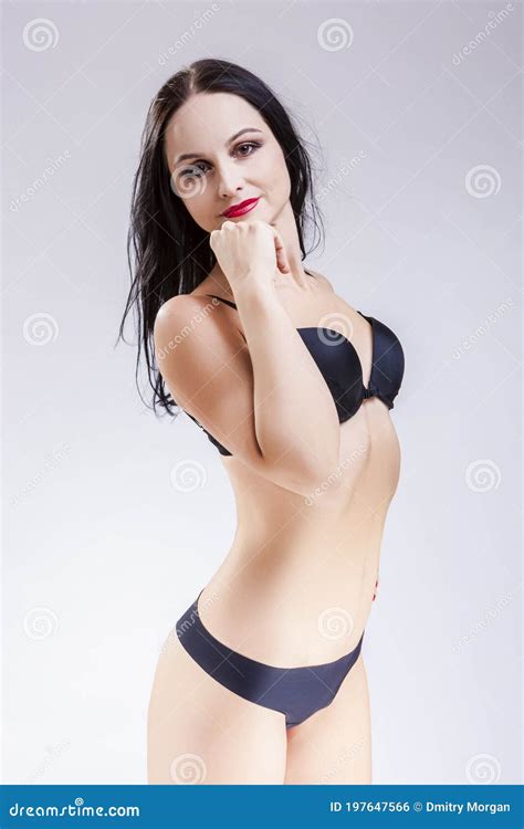 Portrait Of Sensual Mature Caucasian Lady In Black Lingerie Posing