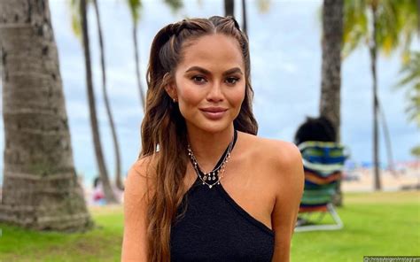 Chrissy Teigen Almost Bares All To Show Off Scar From Breast Implant