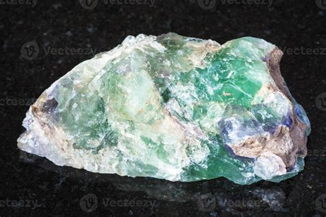 raw green Beryl crystals on black 13546478 Stock Photo at Vecteezy