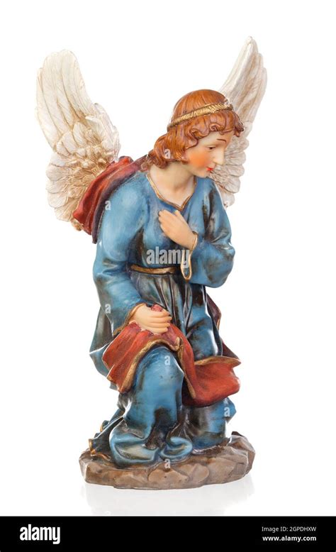 Ceramic figure of the angel of the nativity scene isolated on a white ...