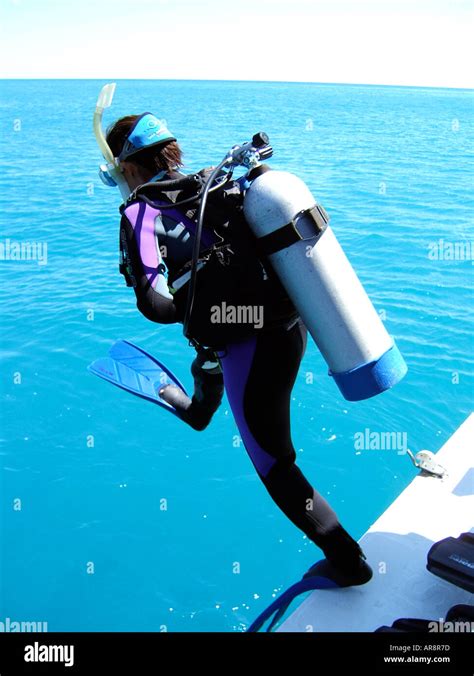 Scuba Diver Jumping Into The Water From A Dive Boatcoastal Waters