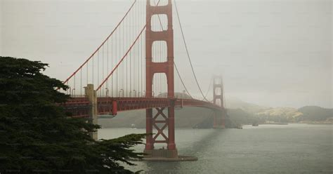 A foggy view of the golden gate bridge photo – Golden gate bridge Image ...