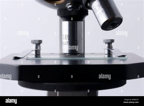 Detail Of Microscope Showing Objective Lenses Stage Specimen Slide