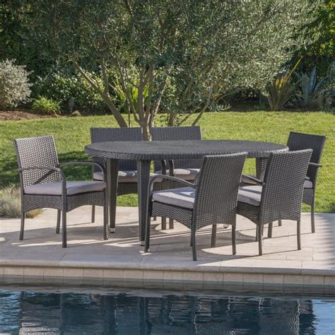 Noble House Kyle Grey 7 Piece Faux Rattan Outdoor Dining Set With Grey