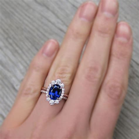 Antique Inspired Oval Blue Sapphire Halo Ring Stacked With A Diamond