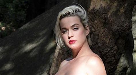 Pregnant Katy Perry strips down in idyllic 'Daisies' music video