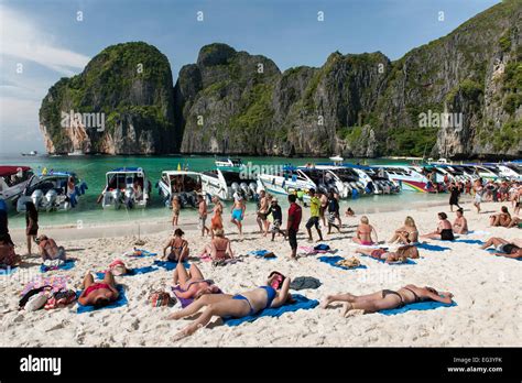 Tourist boats and tourists in Maya Bay on Koh Phi Phi Ley island in ...