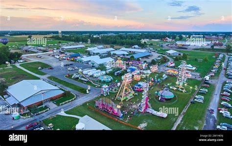 Dusk Light Aerial Over American County Fair With Carnival Stock Photo