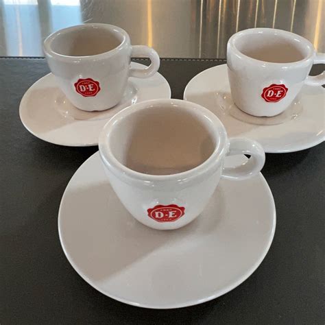 Tre vita espresso koppar med Douwe Egberts logo Köp på Tradera