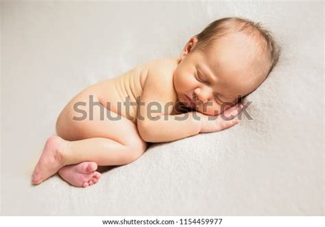 Naked Newborn Baby Sleeping On Light Stock Photo Shutterstock