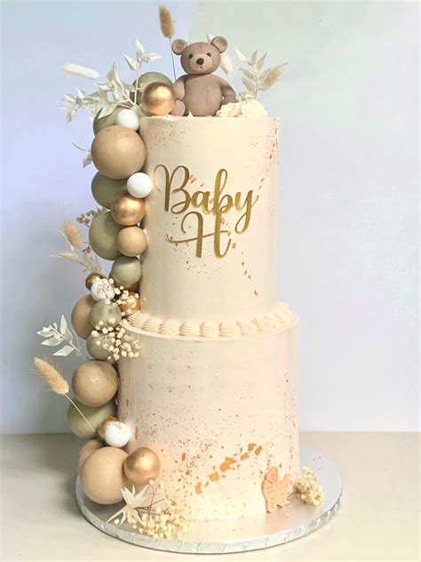 There Is A Cake That Has Been Decorated With Gold And White Decorations