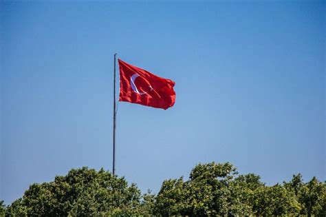 Premium Photo Turkish National Flag With White Star And Moon In Sky