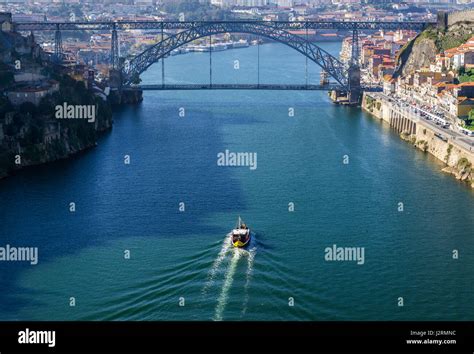 Cruise Ship And Dom Luis I Bridge Over Douro River Seen From Infante D