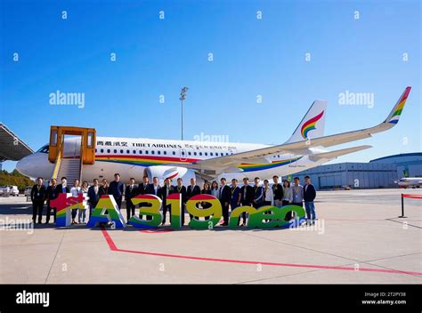 Tianjin St Oct Staff Members Pose For A Group Photo To Mark