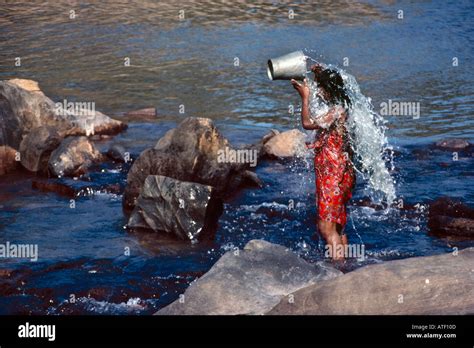 Woman bathing in the Mahaweli River near Kandy Sri Lanka Stock Photo ...