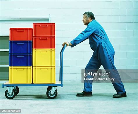 5660 Man Pushing Cart Stock Photos High Res Pictures And Images