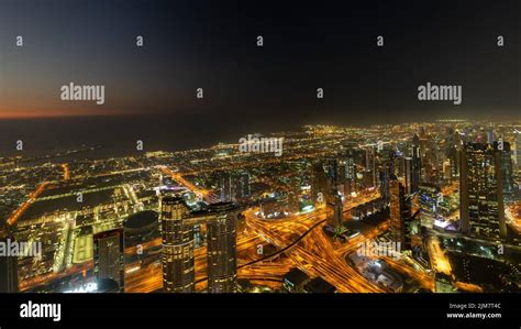 Aerial view of Dubai at night with illuminated modern buildings Stock ...