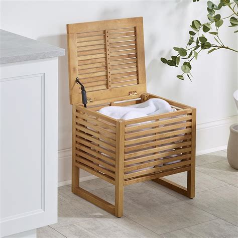 The Rubberwood Towel Hamper Hammacher Schlemmer