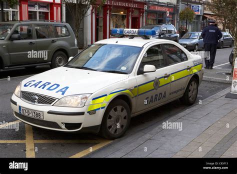 an garda siochana irish police patrol squad car with police officer in ...