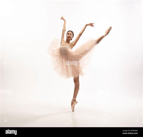 Graceful classic ballerina dancing, posing isolated on white studio ...