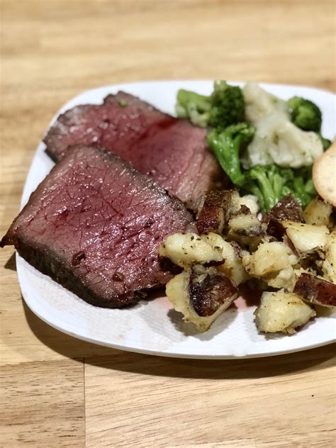 [Homemade] Medium Rare Beef Roast with Herb Crust and red wine sauce! steamed vegetables and ...