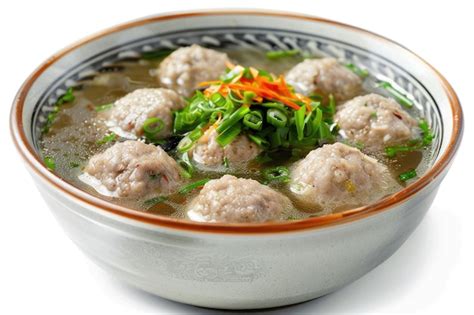 Traditional Indonesian bakso in a bowl isolated on white background ...