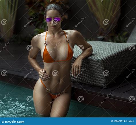 Beautiful Woman With Fit Body In Bikini Tropical Cliff Stock Photo