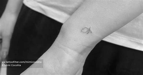 Tiny Lemon Tattoo Located On The Wrist Minimalistic