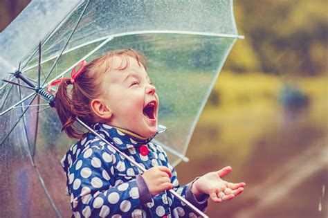 Happy In Rain Stock Photo - Download Image Now - Child, Rain, Umbrella ...