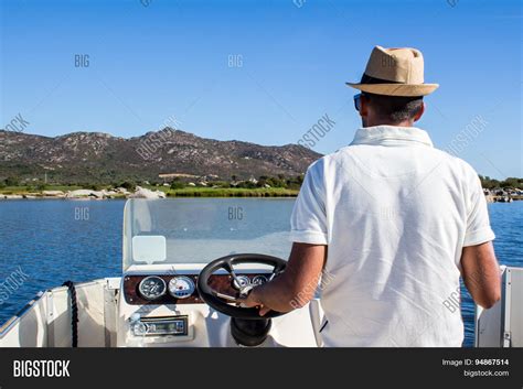 Man Driving Boat Near Image And Photo Free Trial Bigstock