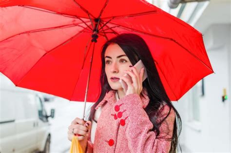 Premium Photo Girl Under A Red Umbrella In The City