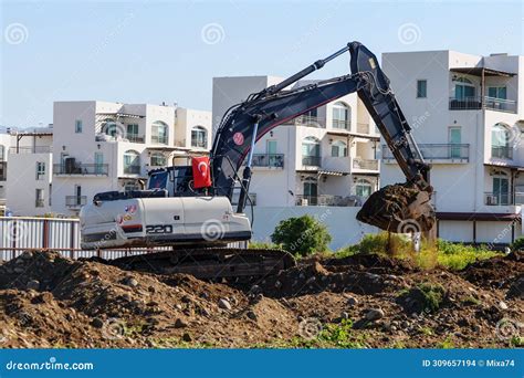 Excavator Digging Soil At A Construction Site 1 Stock Photo Image Of