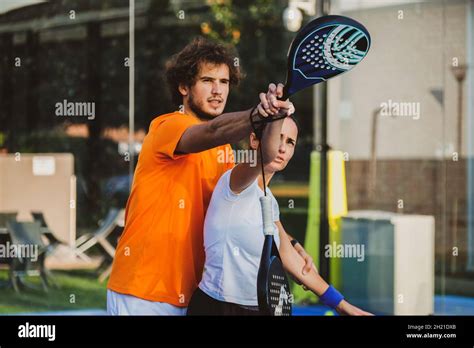 Young Teacher Is Monitoring Teaching Padel Lesson To His Student