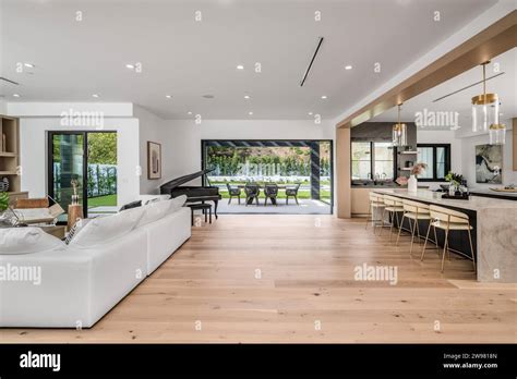 A Contemporary Open Plan Kitchen And Living Room With Large Windows