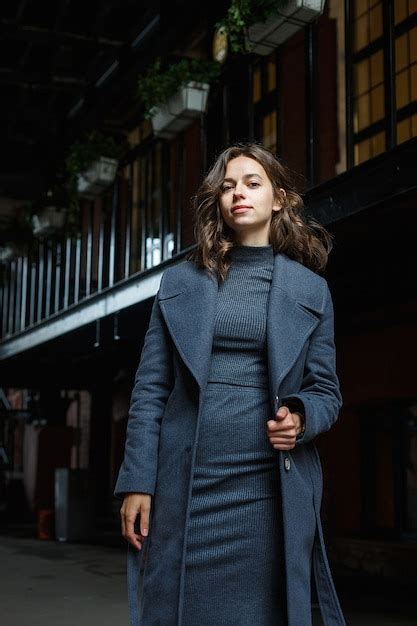 Premium Photo Portrait Of Young Thoughtful Girl In Gray Coat And