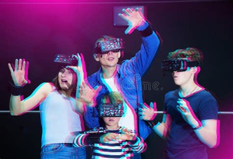 Cheerful Family in Virtual Reality Goggles Playing Games Together Stock ...