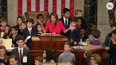 Speaker Nancy Pelosi surrounded by kids as she swears in