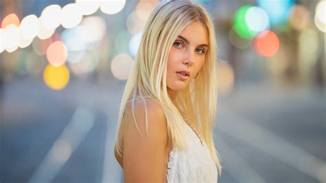 Beautiful Blonde Blue Eyes Girl Model Is Wearing White Dress Standing