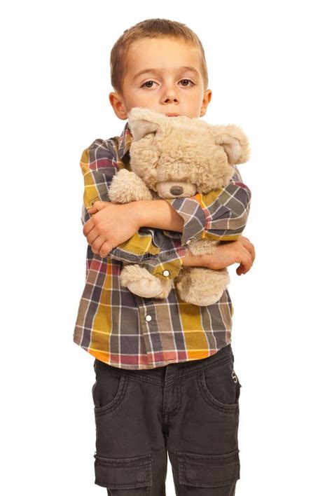 Sad kid hugging teddy stock image. Image of shot, background - 27651893